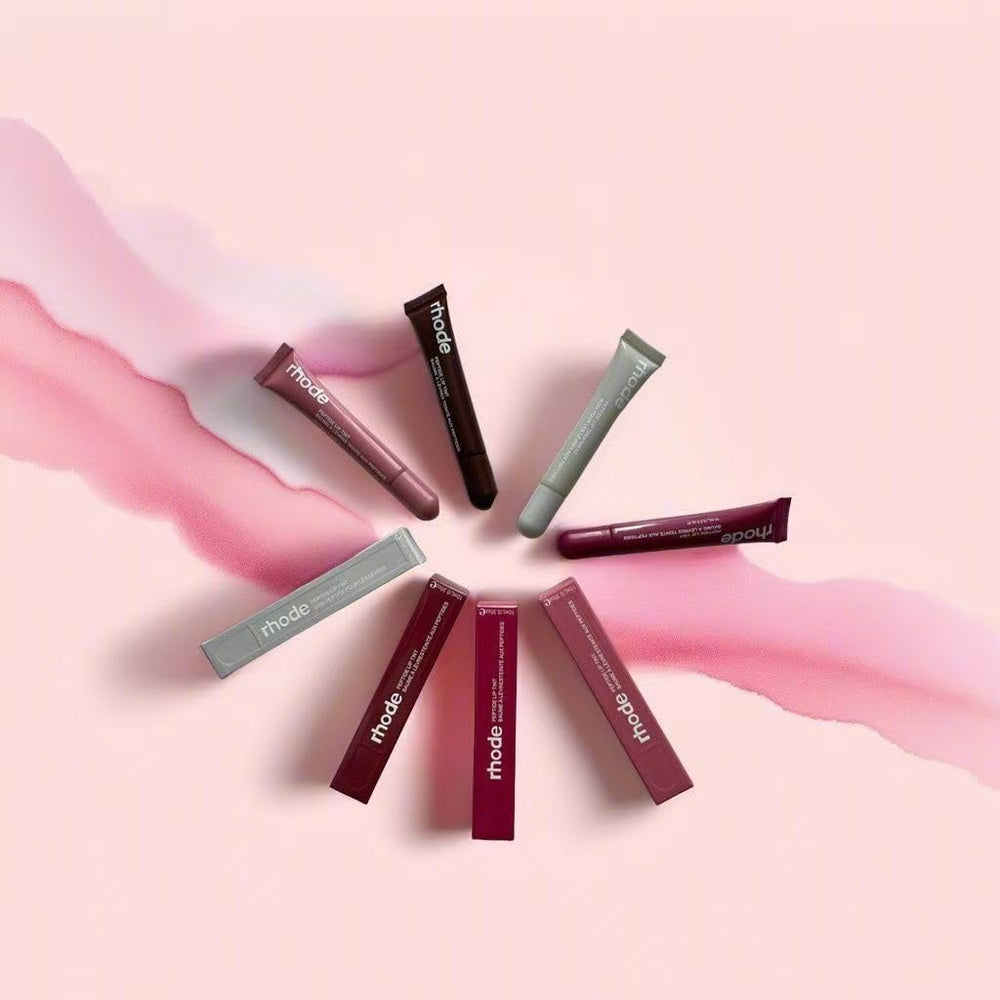 Lips wearing Rhode Gloss Lip Tint showing translucent color and natural shine.