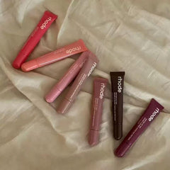 Close-up of Rhode Gloss Lip Tint wand applying a hydrating, buildable tint.