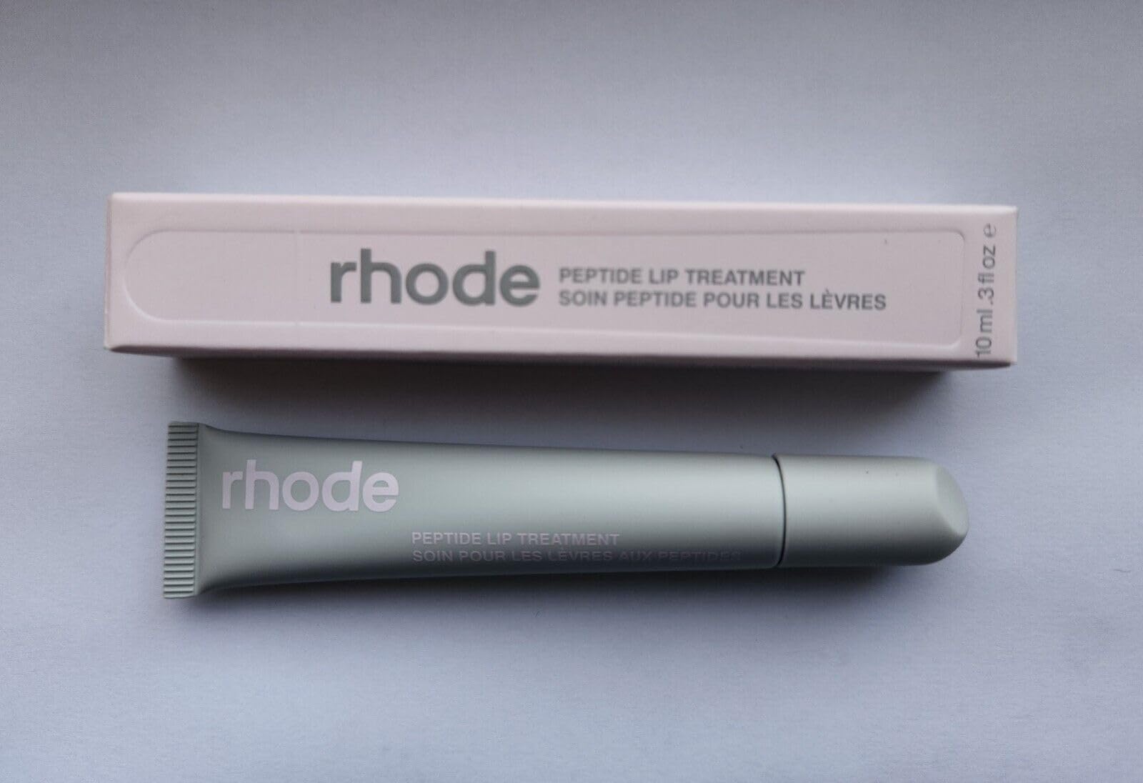 Rhode Hailey Bieber peptide lip treatment Watermelon Slice bottle delivers nourishment and a glossy finish.