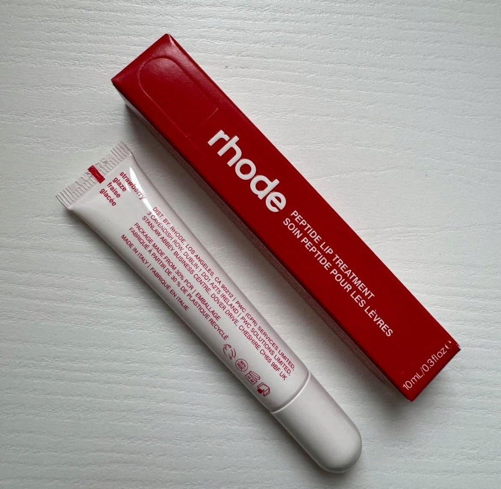 Rhode Lip Treatment Strawberry Glaze in action, offering glossy finish and nourishment