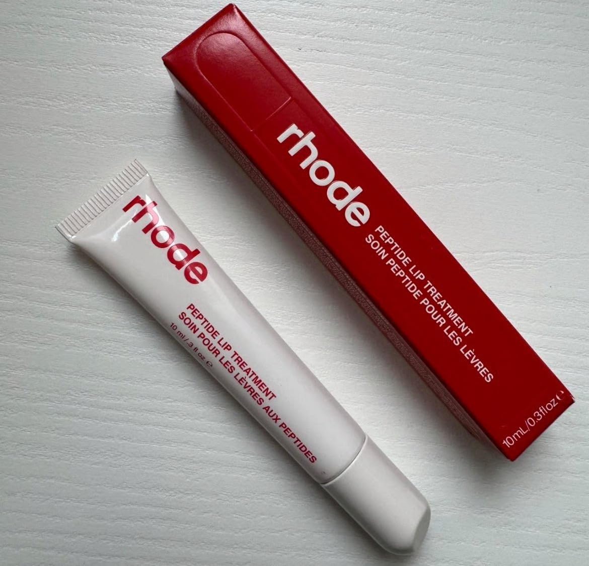 Rhode Lip Treatment Strawberry Glaze tube providing hydration and shine