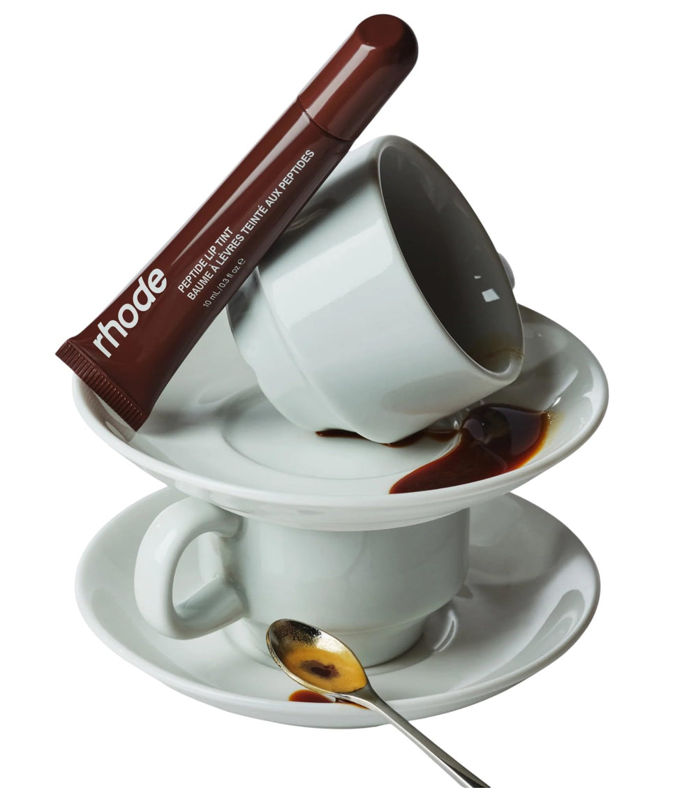 Rhode peptide lip tint Espresso applying on lips for hydration and subtle shine