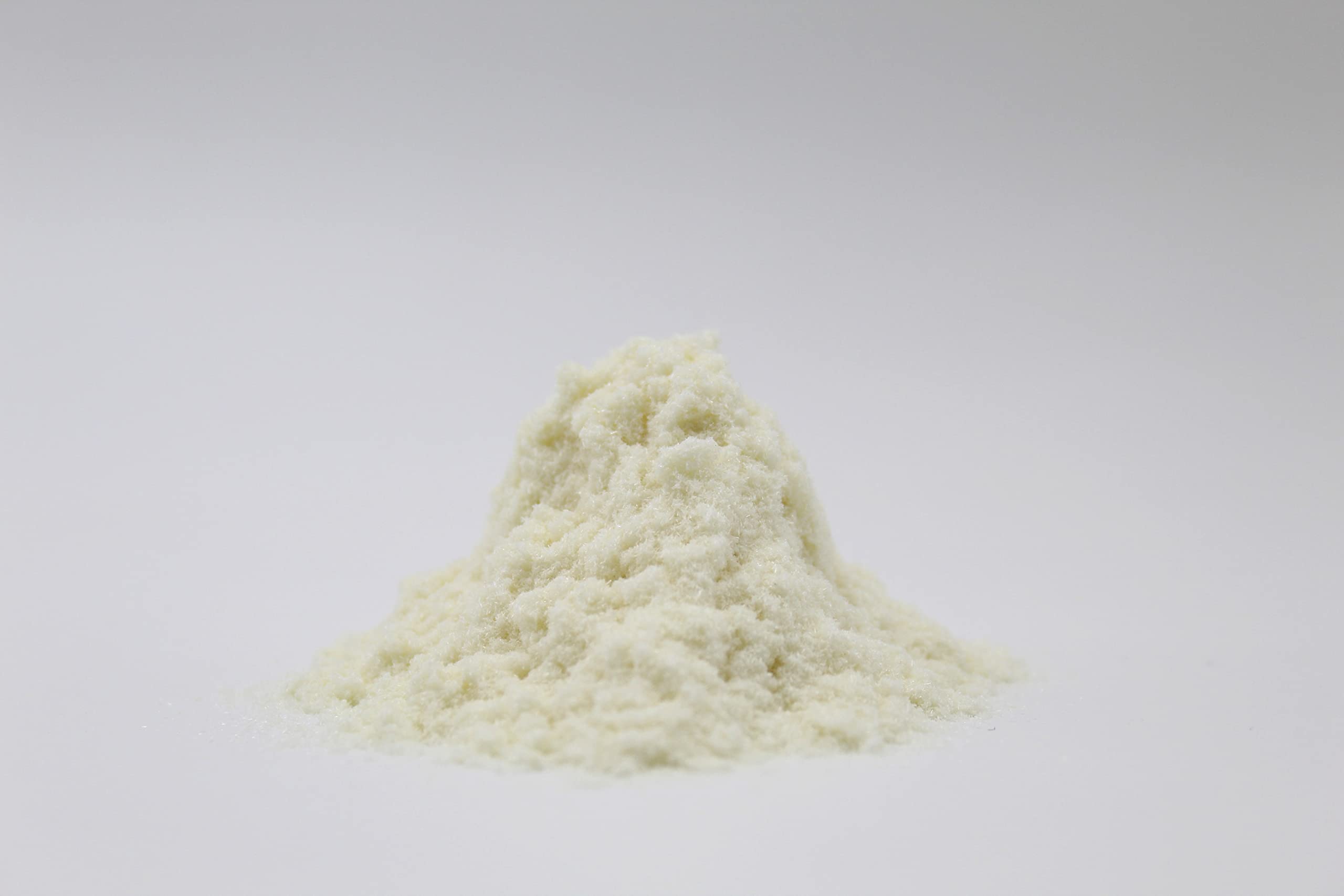 Rice Essence Kojic Acid Powder close-up reveals fine, silky powder for formulations.