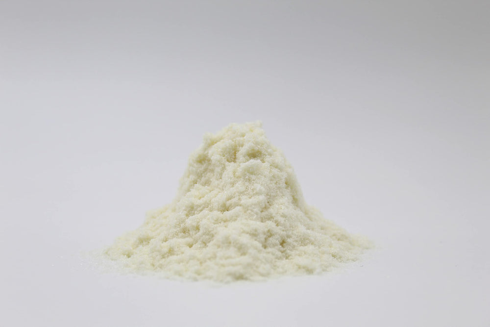 Rice Essence Kojic Acid Powder close-up reveals fine, silky powder for formulations.