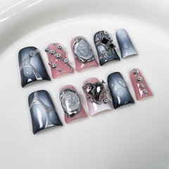 RIICFDD duck press-on nails in blue-white gradient with rhinestone heart embellishment