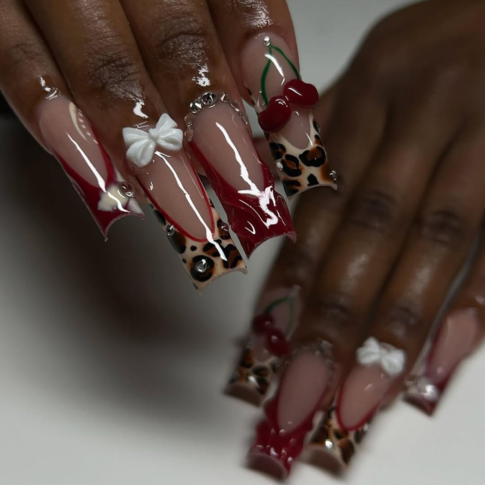 RIICFDD glue-on nails with cherry charms add playful accents and secure wear.