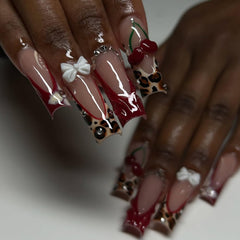 RIICFDD glue-on nails with cherry charms add playful accents and secure wear.