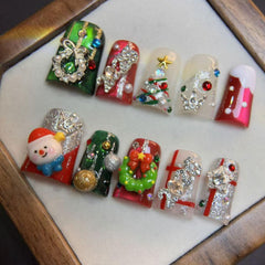 RIICFDD nails with rhinestone accents for holiday glamour and sparkle.
