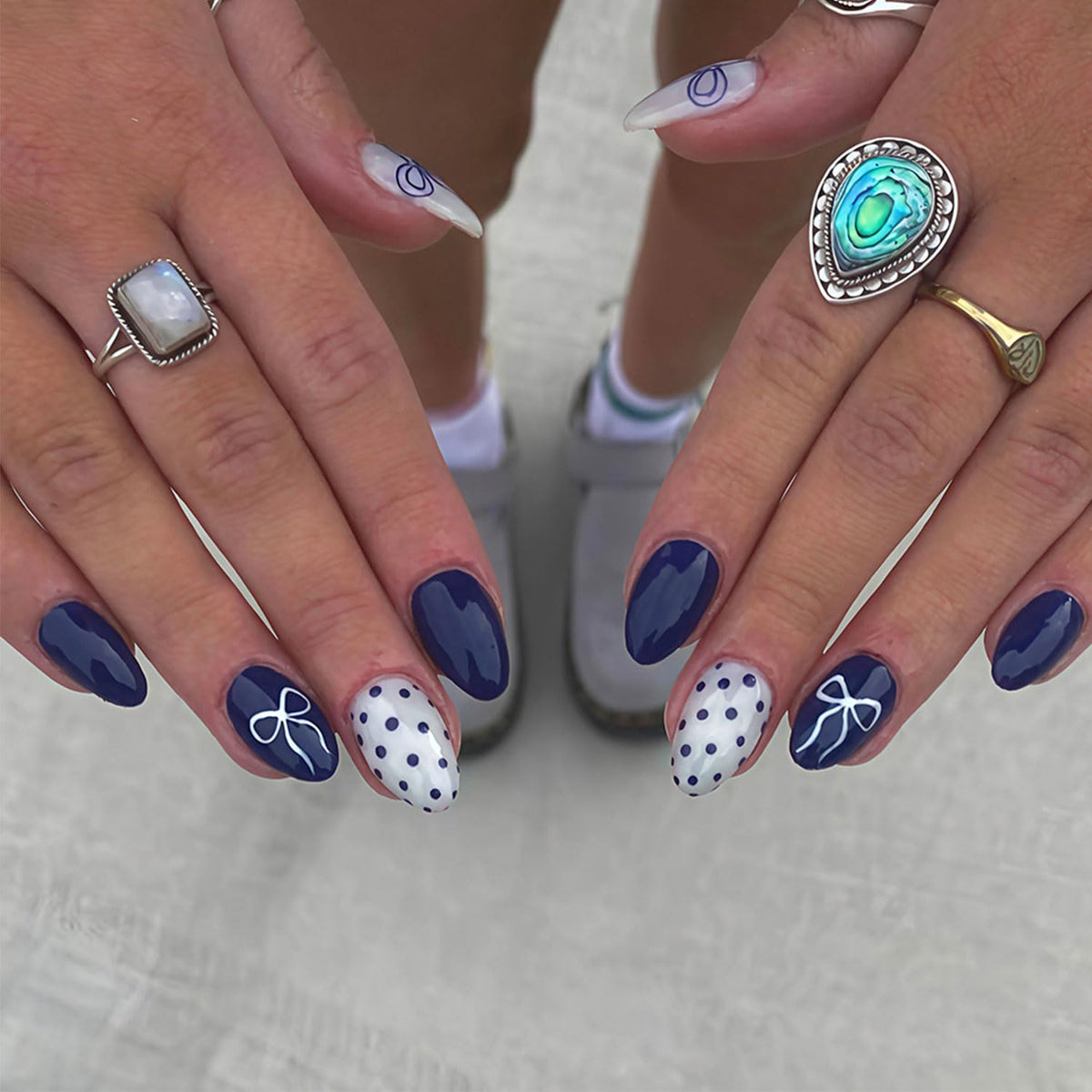 RIICFDD press-on almond nails with dark blue dots and bow for elegant at-home manicure