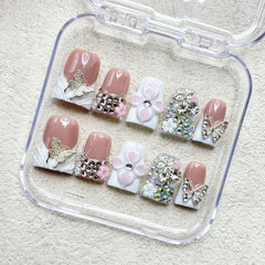 RIICFDD rhinestone butterfly design nails for a shimmering accent.