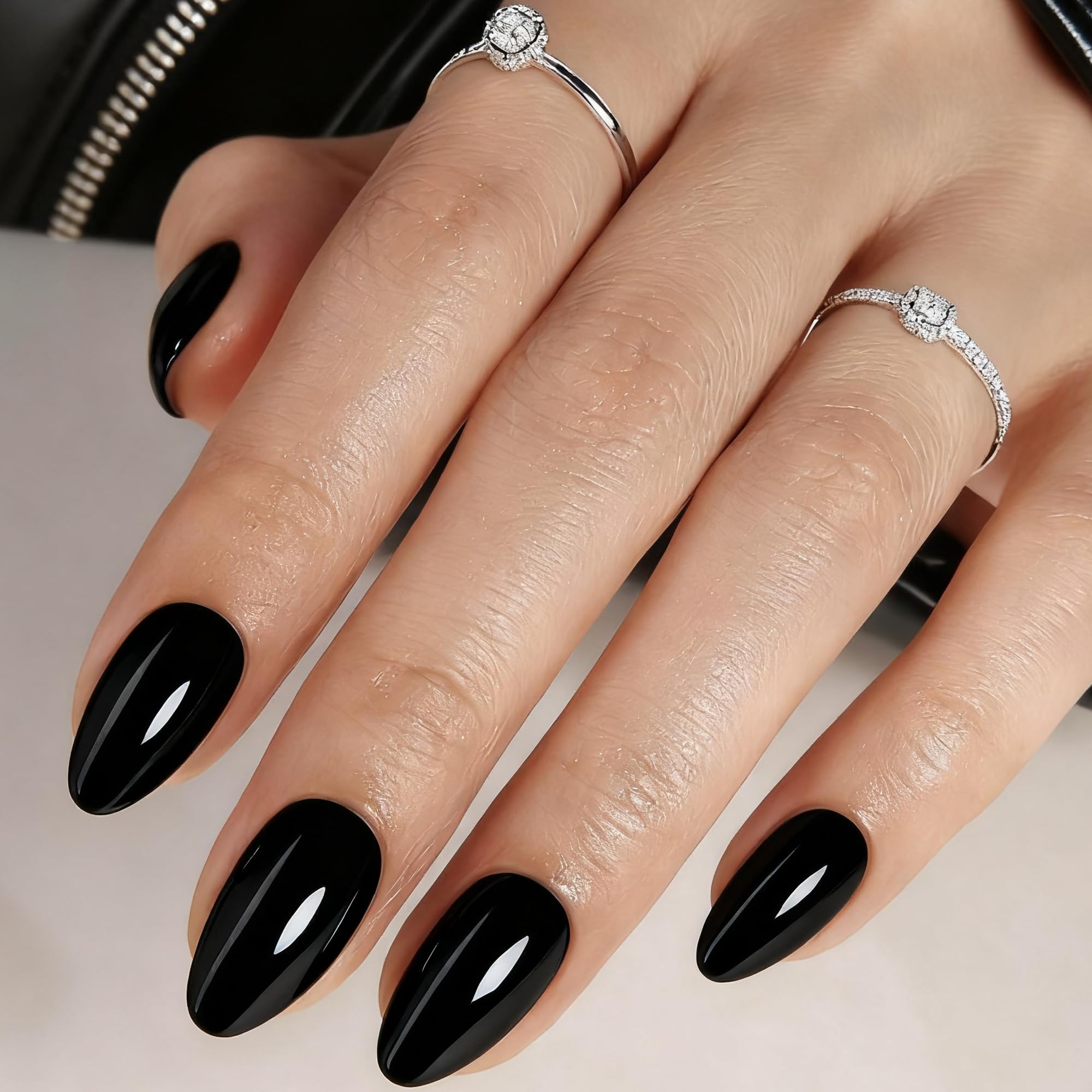 Rimudecure Black Almond press-on nails with a glossy gel finish for salon-like nails.