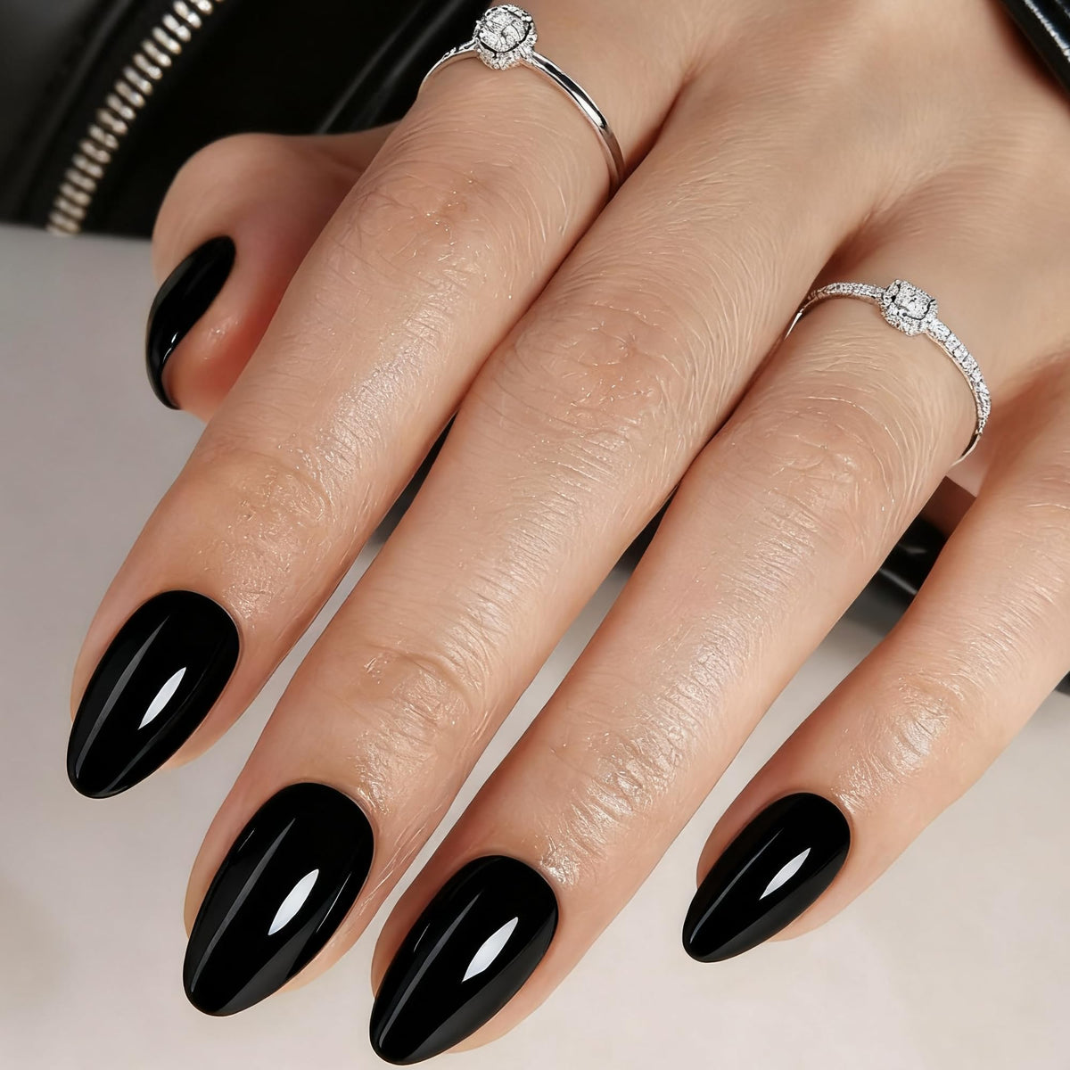 Rimudecure Black Almond press-on nails with a glossy gel finish for salon-like nails.
