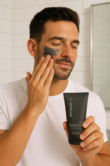 Applying RITUALS Homme Charcoal Face Scrub on facial skin, target impurities with gentle scrub action.