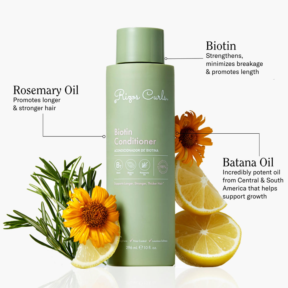 Hands apply Biotin Conditioner to detangle hair with ease.