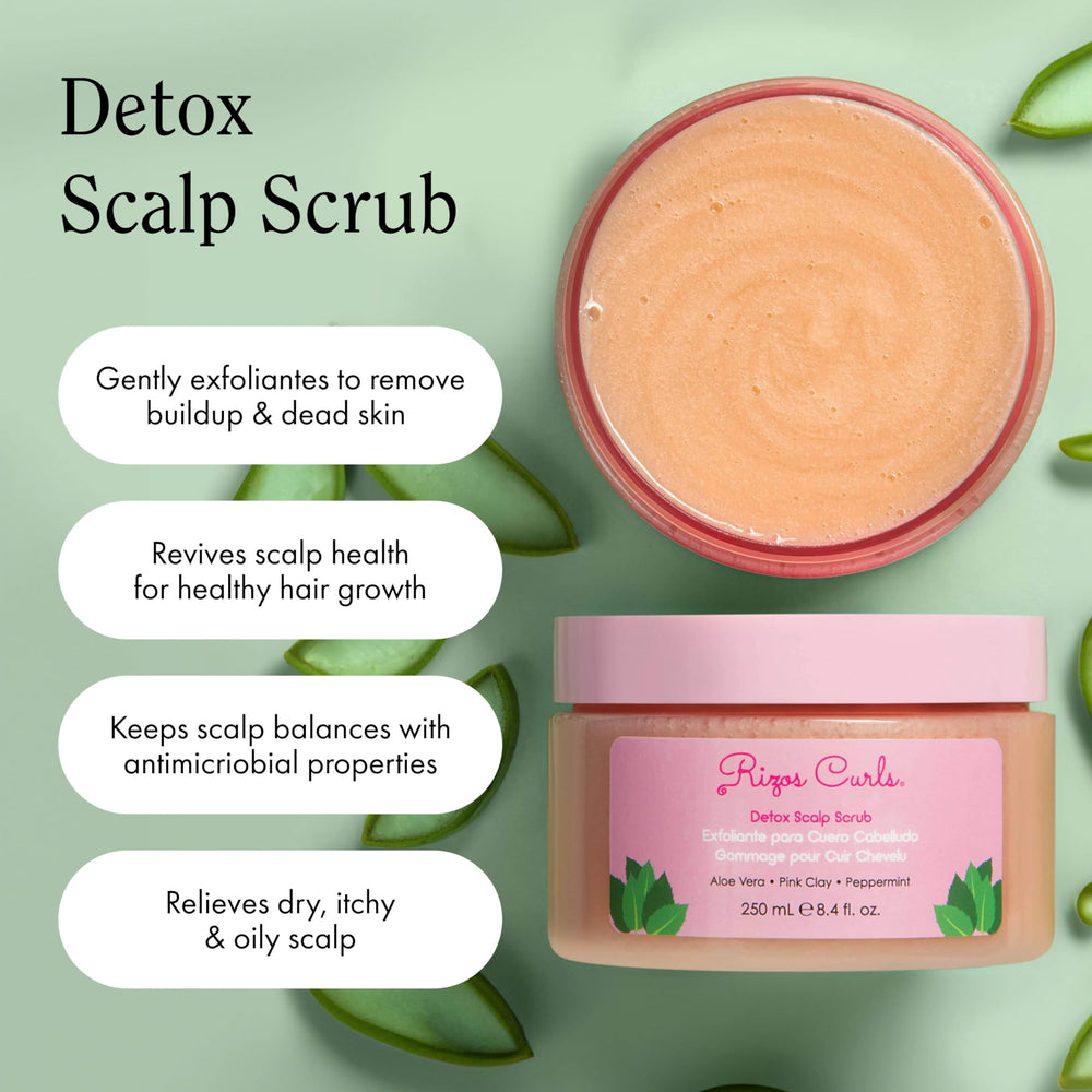 Rizos Curls Detox Scalp Scrub close-up brush in use for exfoliation.