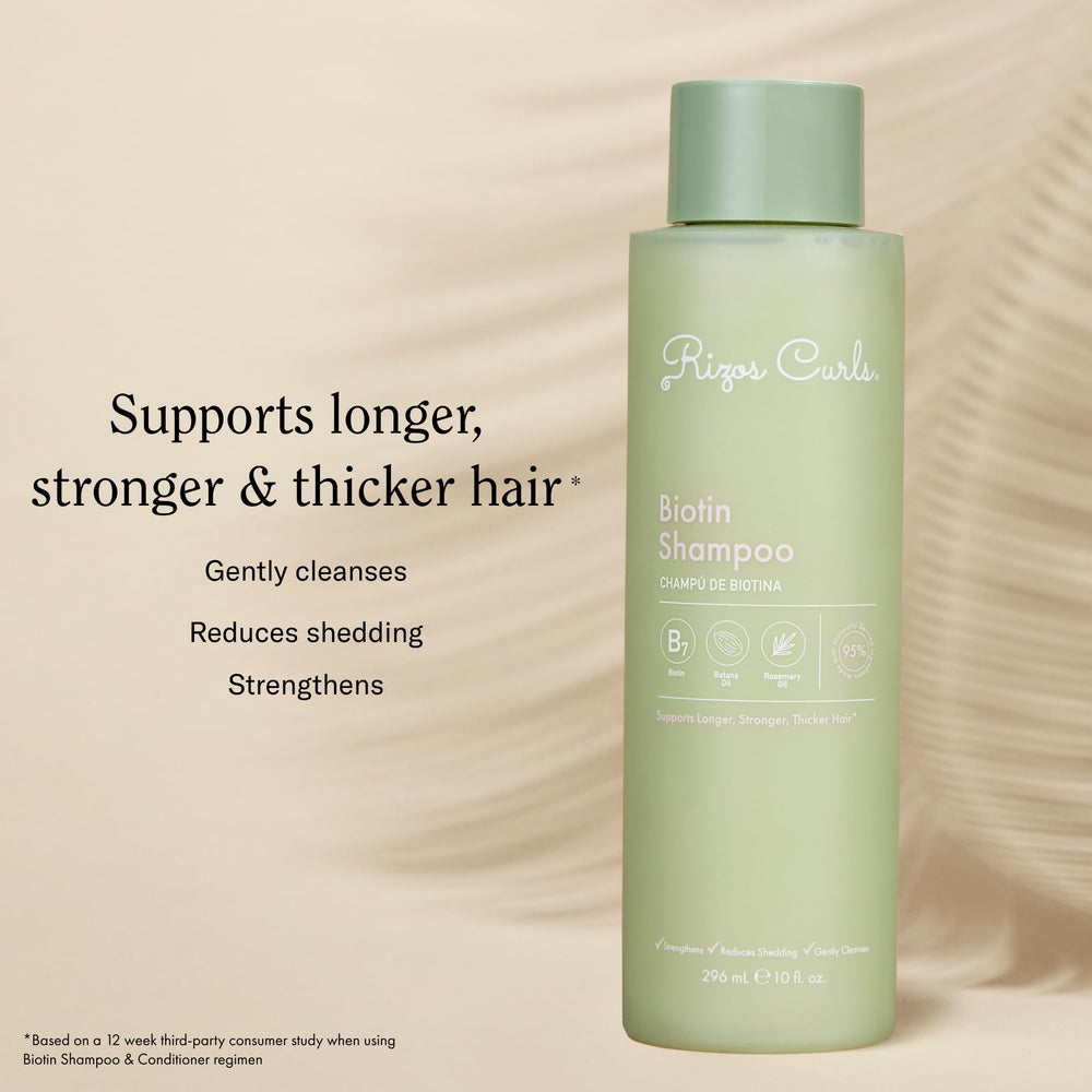 Rizos Curls Biotin Shampoo with rosemary oil; promotes shine and softness.