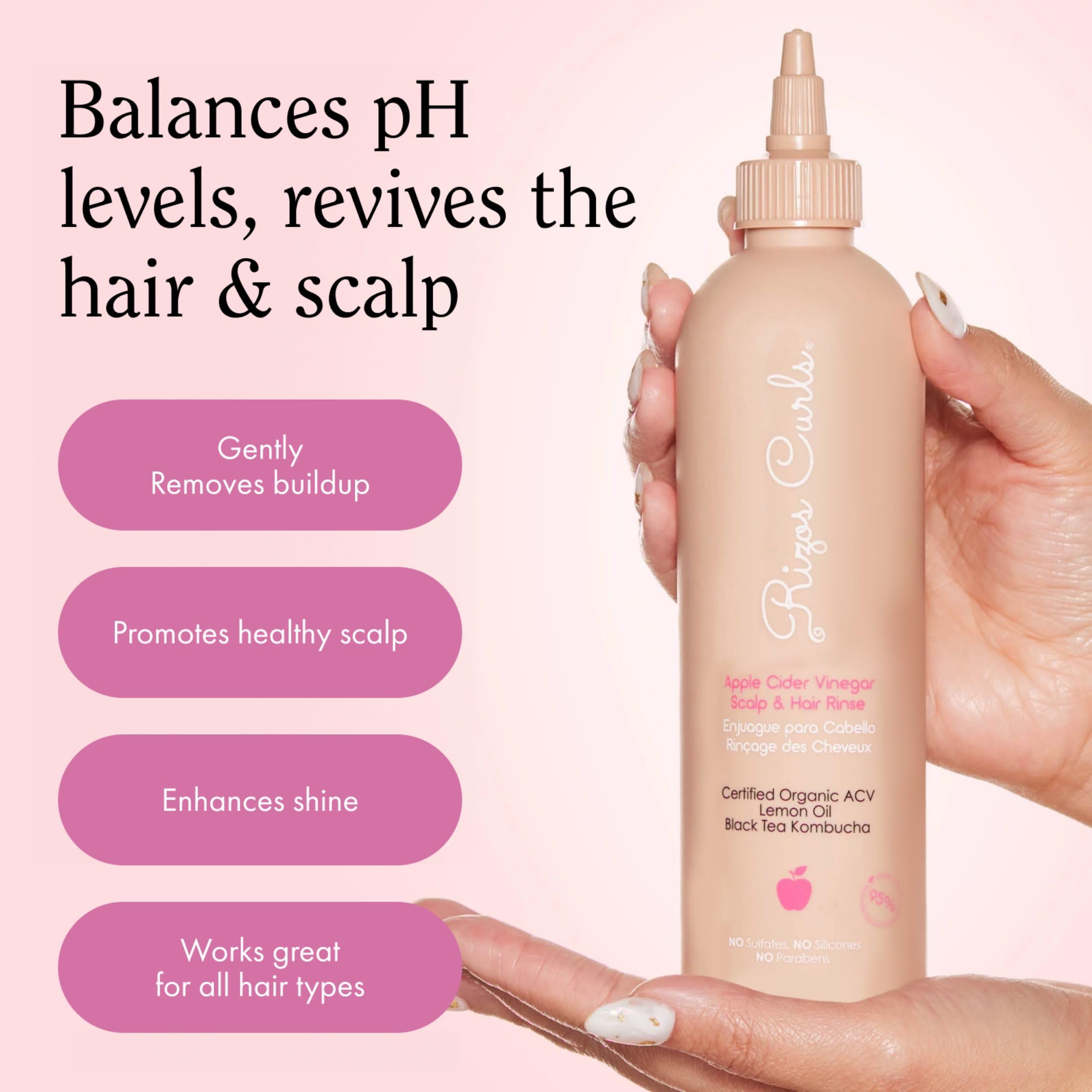 Rizos Curls travel ACV rinse lathering on hair demonstrates cleansing action and scent.