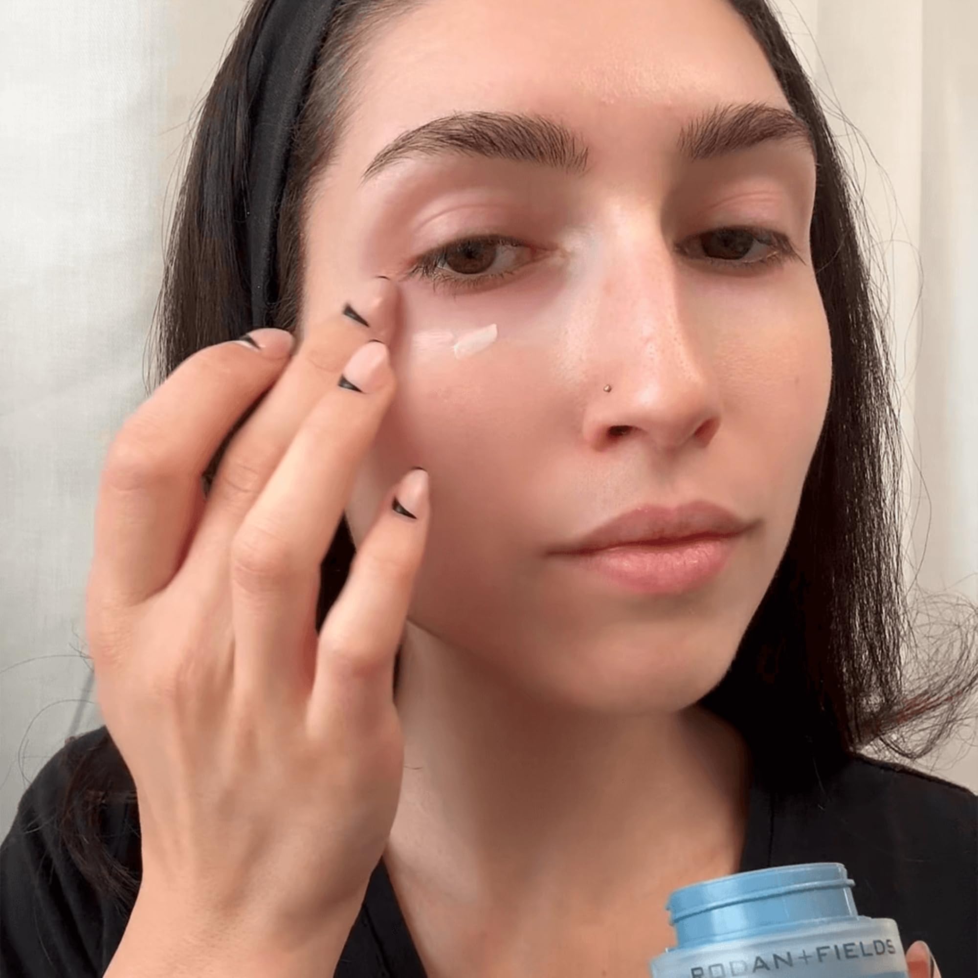 Rodan + Fields Redefine Eye Cream bottle on vanity exuding subtle radiance