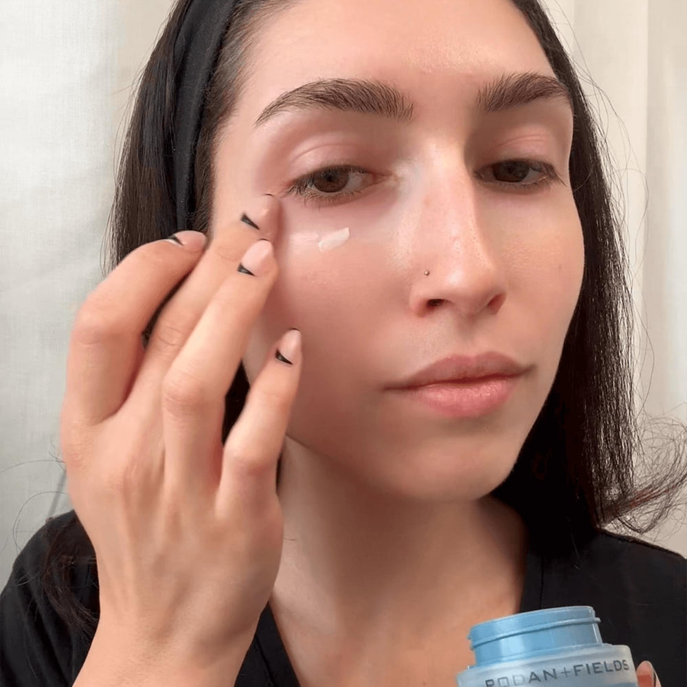 Rodan + Fields Redefine Eye Cream bottle on vanity exuding subtle radiance