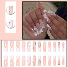 ROFIBUT glossy nude nails with 3D rhinestones for subtle sparkle