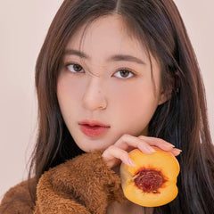 romnd Fruit Lip Candy gloss application on lips delivers a subtle glow.