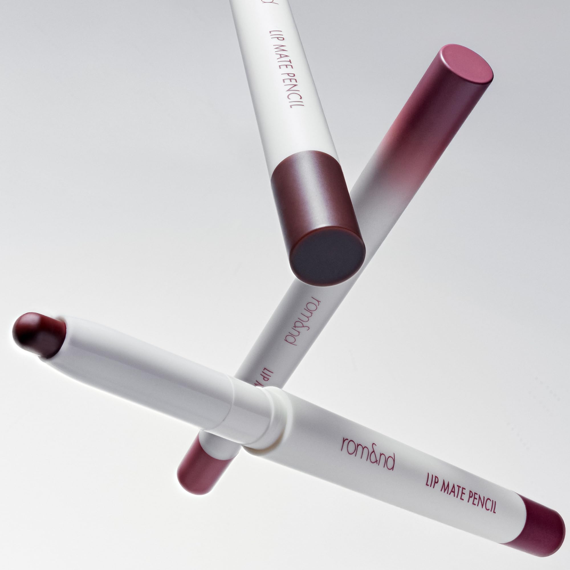 rom&nd Lip Mate Pencil 09 Plum Burgundy on lip provides bold definition and longevity.