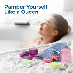 Rosca shower steamers under hot water releasing aroma from foil packaging