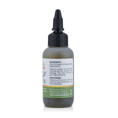 Roselle Naturals Chebe Oil bottle closeup showing premium blend