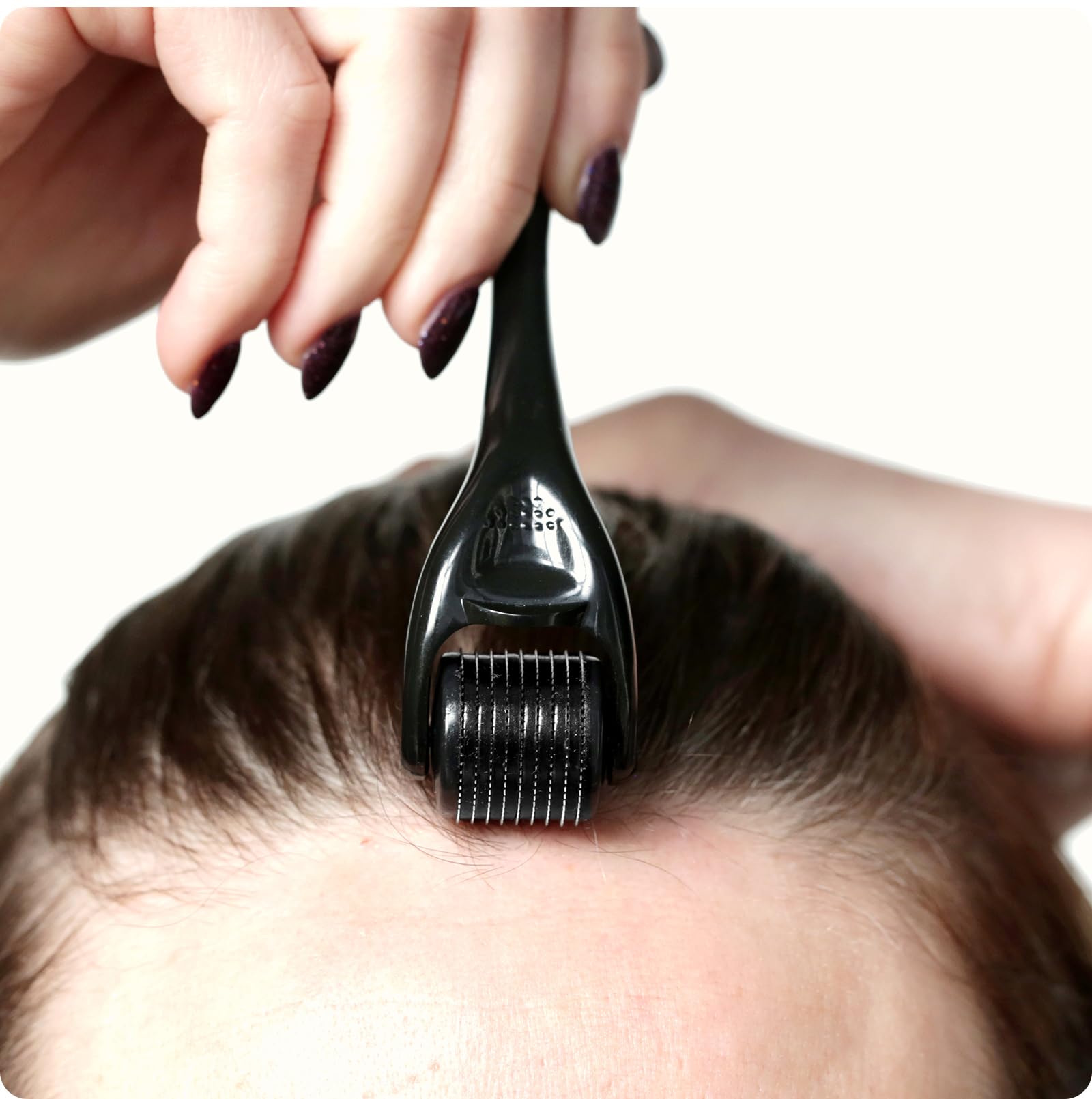 ROSELYNBOUTIQUE Derma Roller applied to beard area for grooming