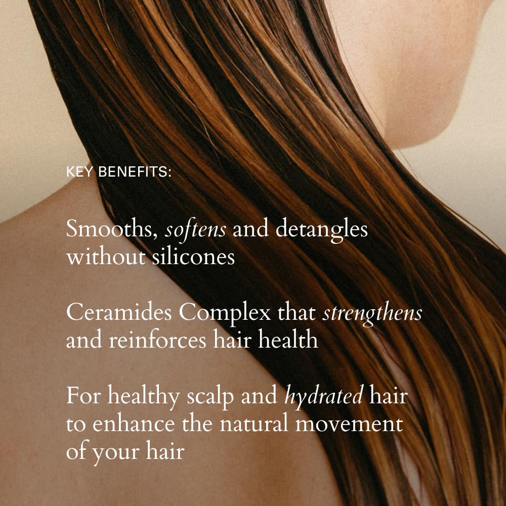 Hair being detangled after applying RŌZ Foundation Conditioner for smoothness.