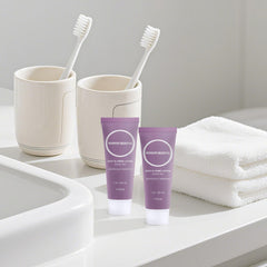 RSQAZQ travel size lotion 1oz tube in carry-on bag, ready for daily moisturization.