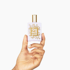 Closeup of Rue 21 Gold bottle highlighting premium design.
