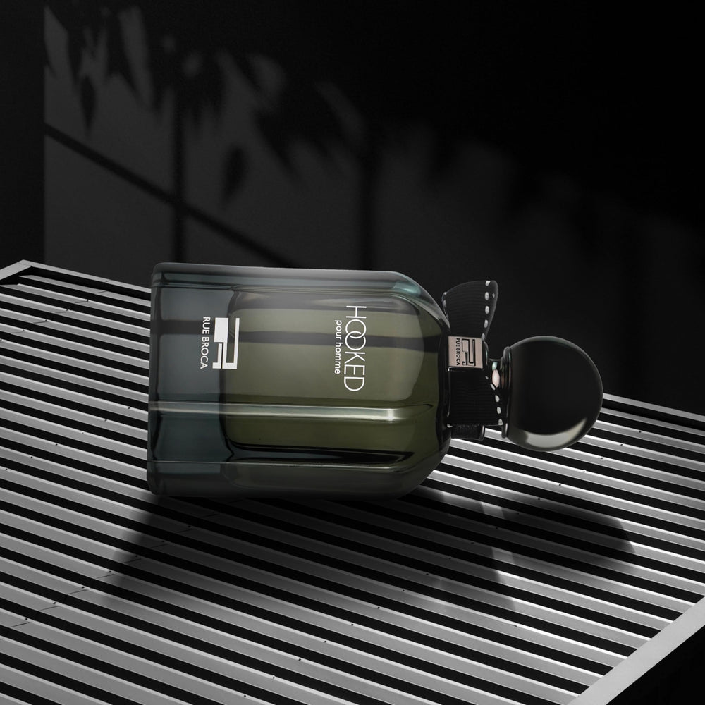 Rue Broca Hooked Pour Homme amber tones suggesting warmth and signature scent.