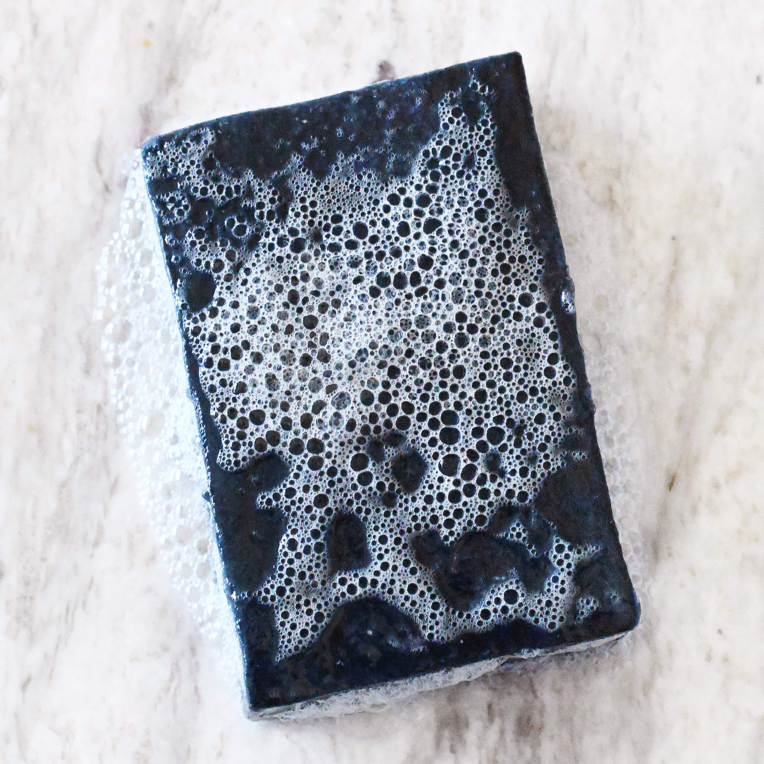 Rustic Maka soap with olive, coconut, and palm oils supports gentle cleansing
