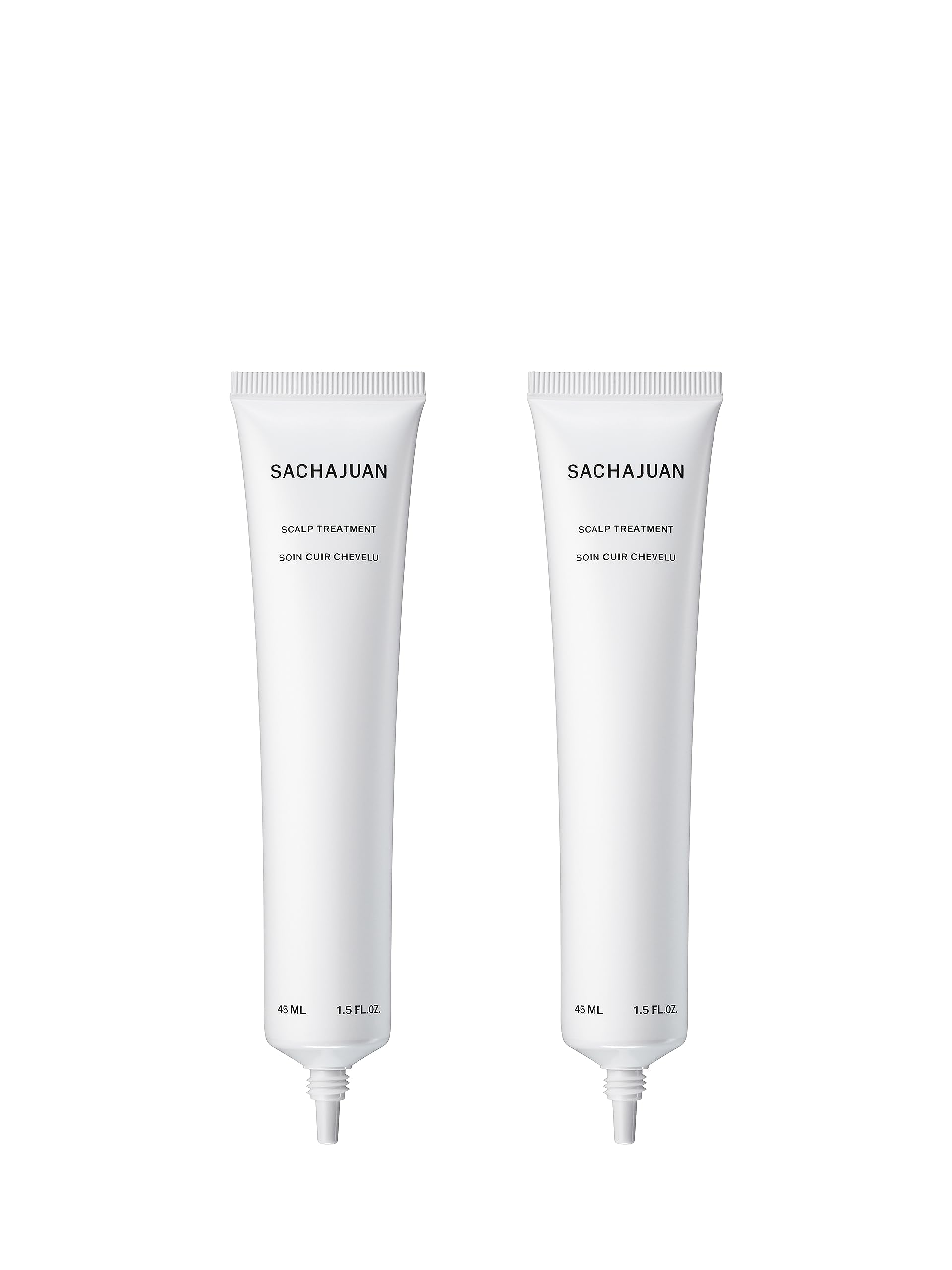 Close-up of SACHAJUAN Scalp Treatment being applied for dandruff relief.