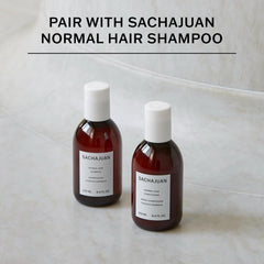 SACHAJUAN conditioner on hair delivering soft shine and bounce in a close-up.