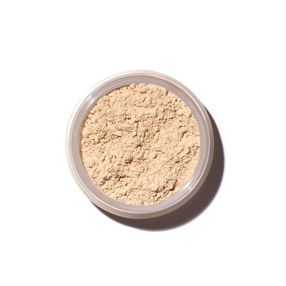 Saie Airset translucent powder bottle pour helps set makeup with a weightless, radiant finish.