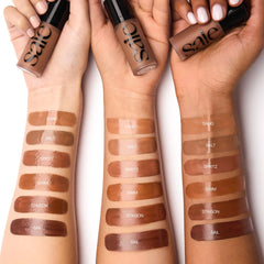 Saie Dew Bronze applied on forehead and nose for soft radiance.