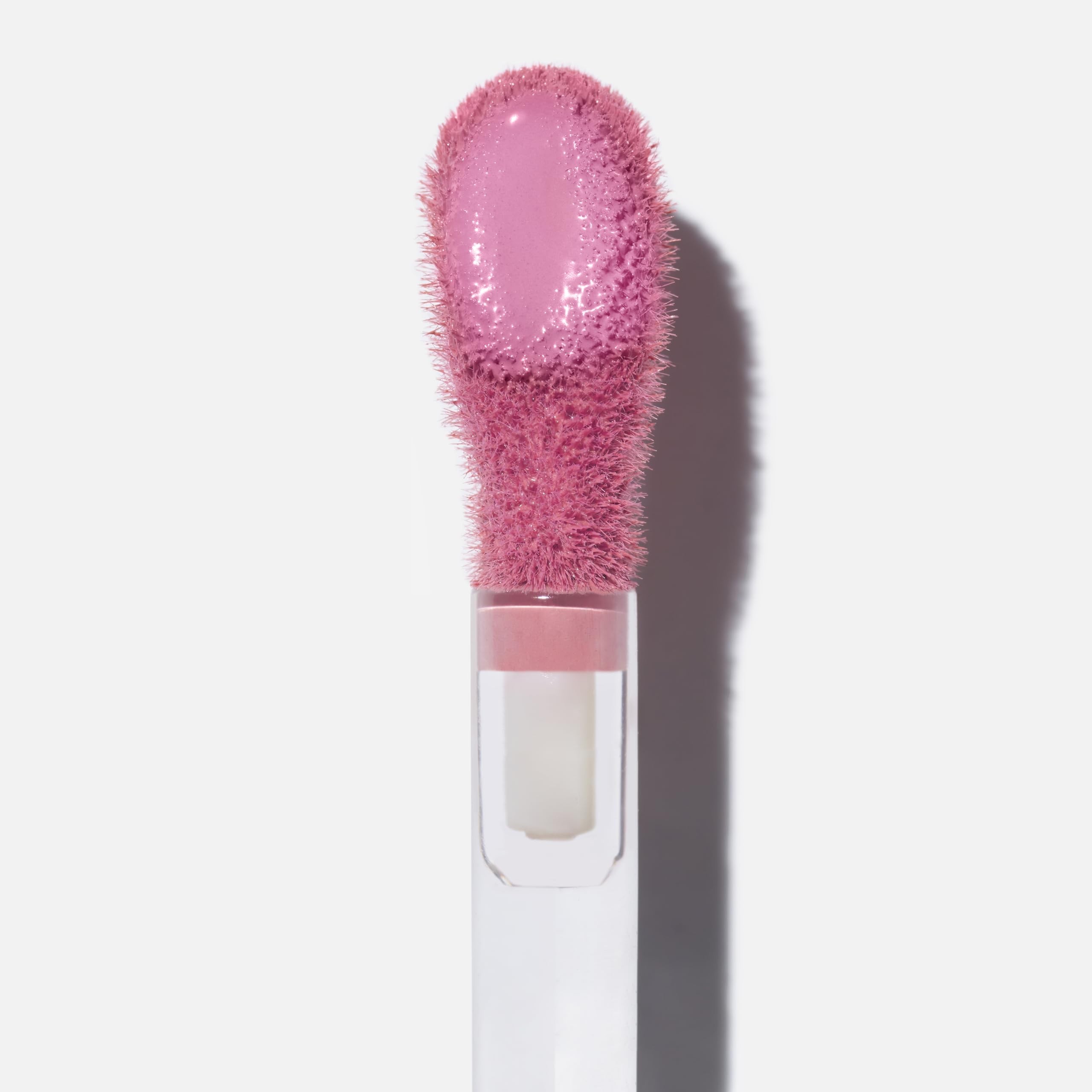 Saie Dew Liquid Blush swatches on cheek show natural flush