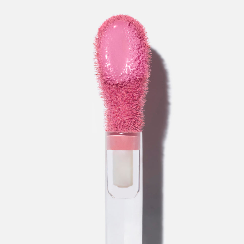 Saie Dew Liquid Blush swatches on cheek show natural flush