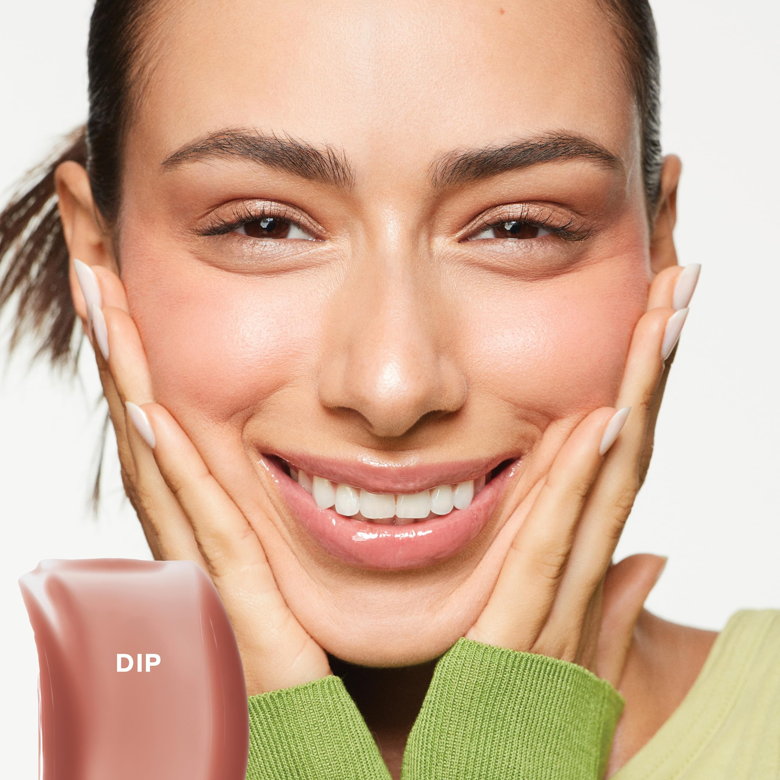 Saie Glossybounce doe-foot applicator for precise, even lip coverage.