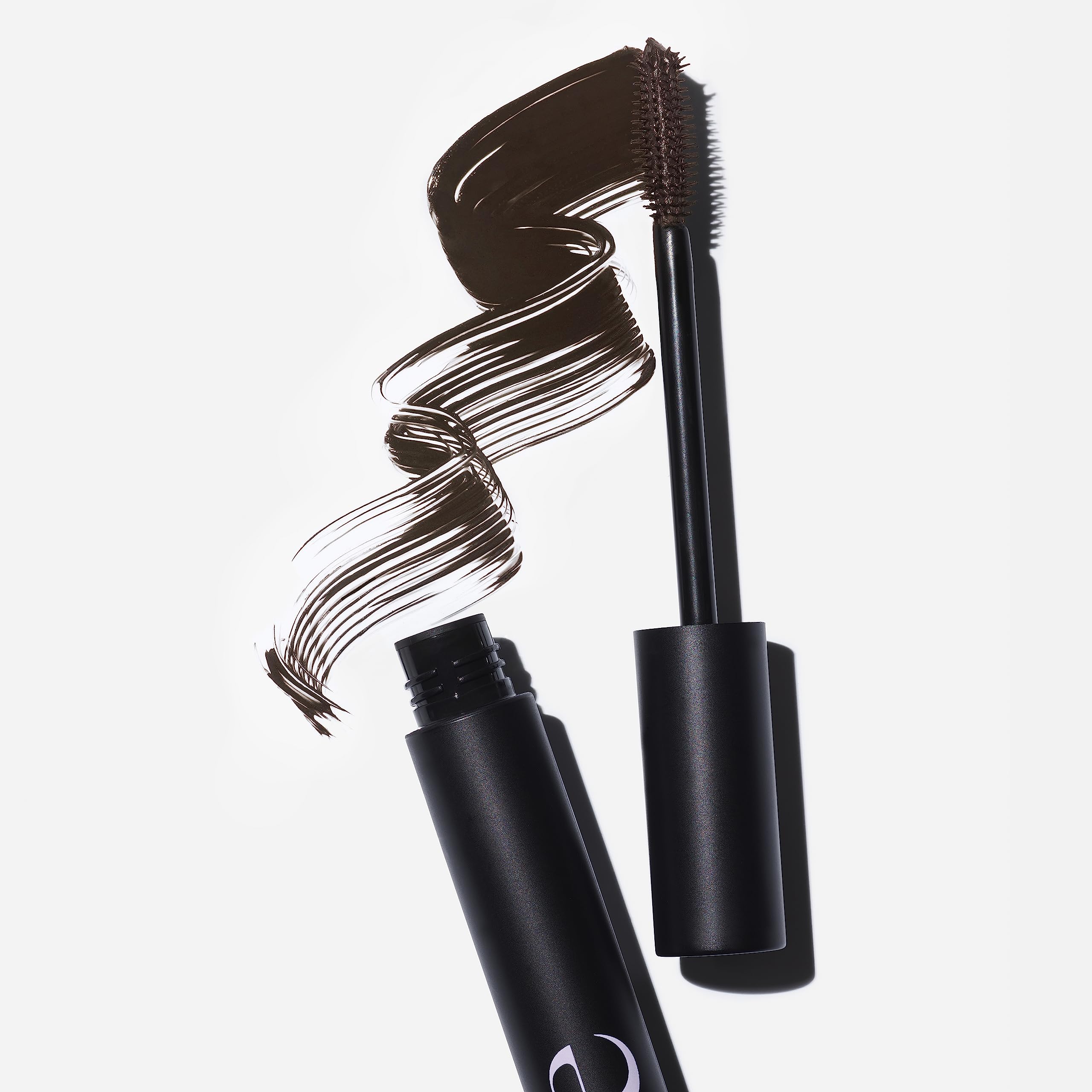 Saie Mascara 101 application-wiggle technique highlights precise lengthening at roots.