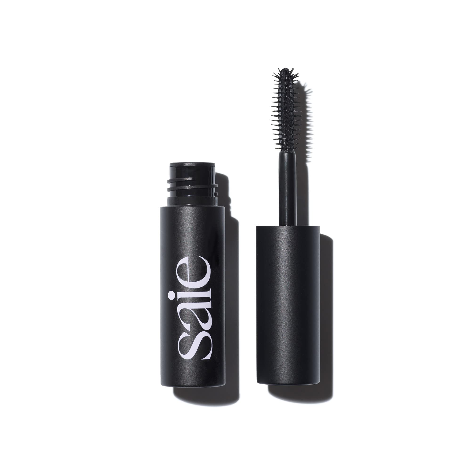 Saie Mini Mascara 101 wand in action for lengthened, lifted lashes.