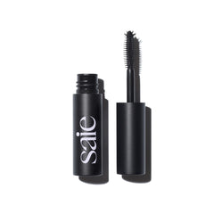 Saie Mini Mascara 101 wand in action for lengthened, lifted lashes.