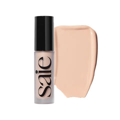 Saie Slip Tint bottle close-up showing radiant finish and lightweight texture.