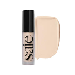 Saie Slip Tint packaging close-up showing a sleek concealer tube for portable coverage