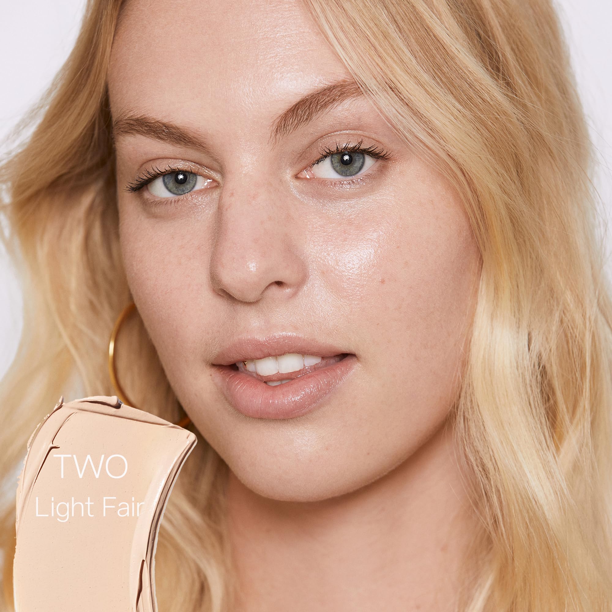 Saie Slip Tint Two application on fingertips for a natural glow.