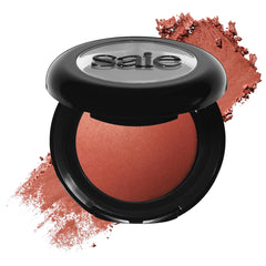 Saie SuperSuede blush close-up highlights luxurious baked texture for a soft, diffused flush.