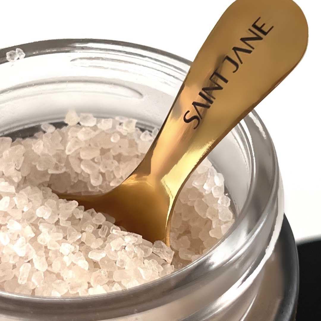 SAINT JANE Deep Sleep Bath Salts pour demonstrates relaxing ritual after a long day
