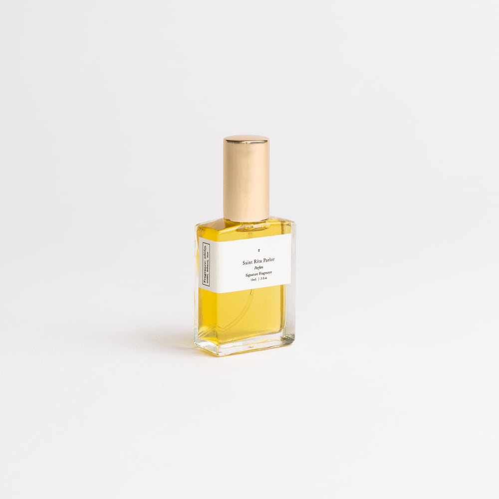 Saint Rita Parlor Signature Parfum bottle with tobacco notes for sophisticated daytime elegance.